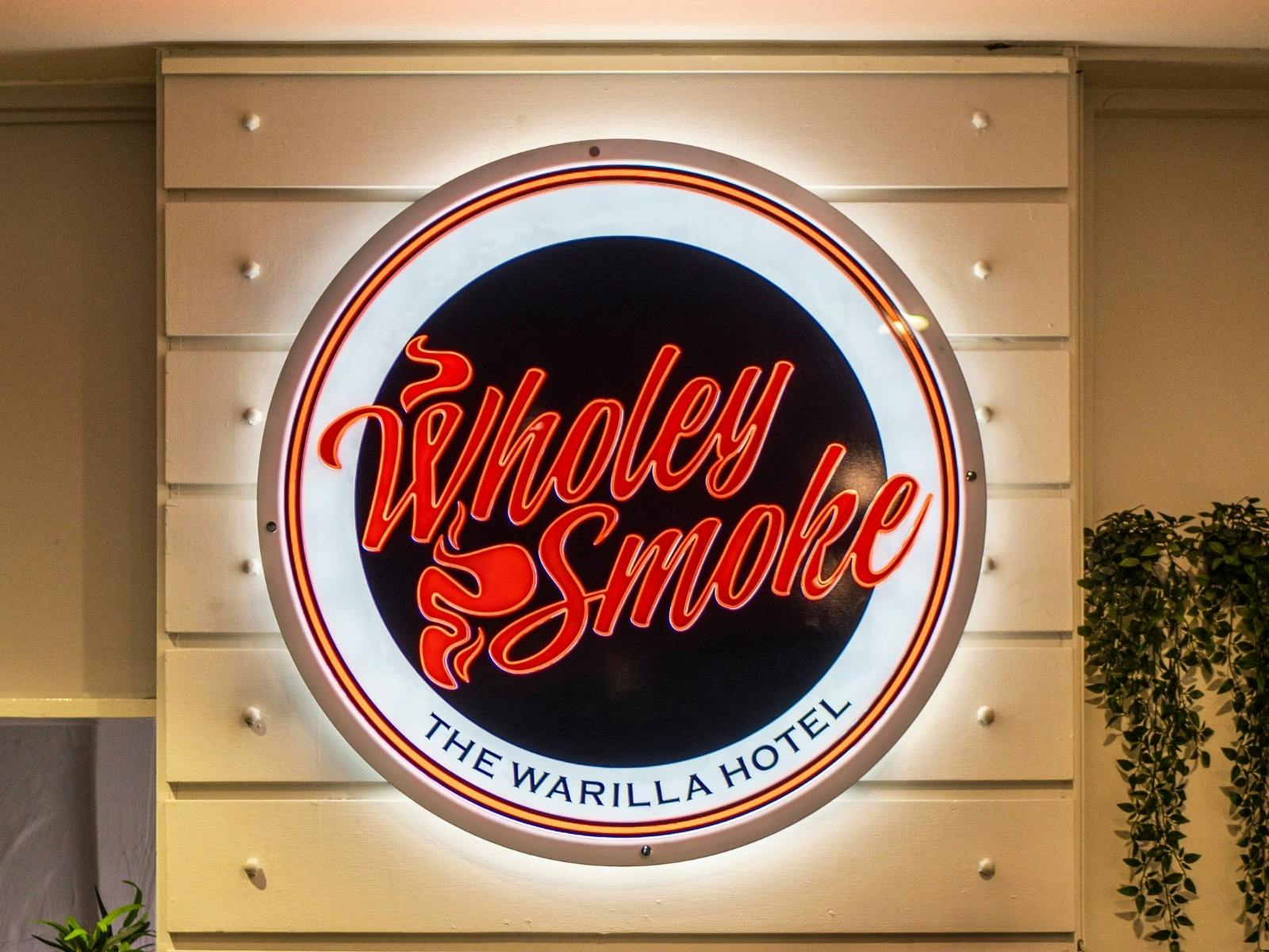 Logo of Wholey Smoke Bistro