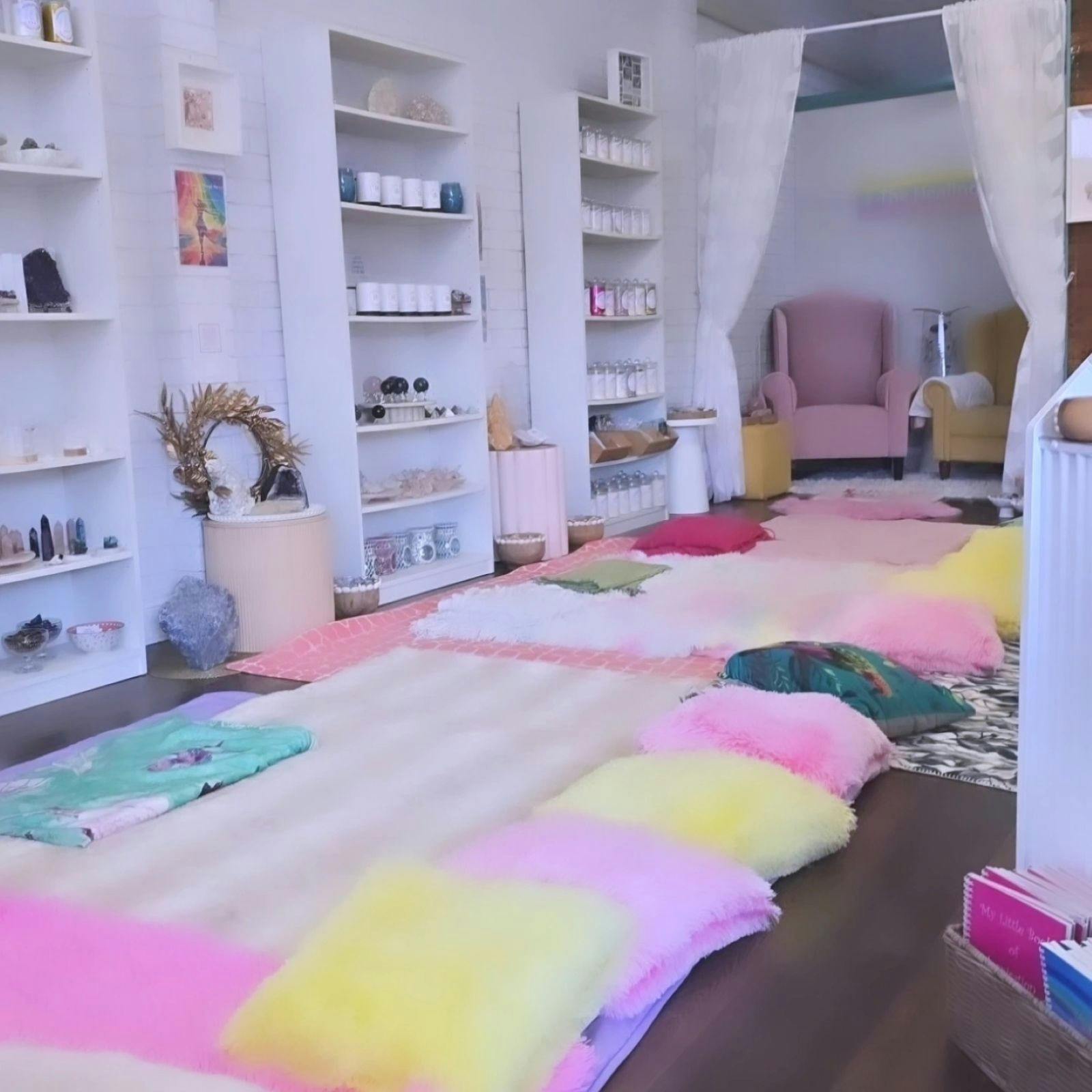 Shop set up for meditation with cushions and mats
