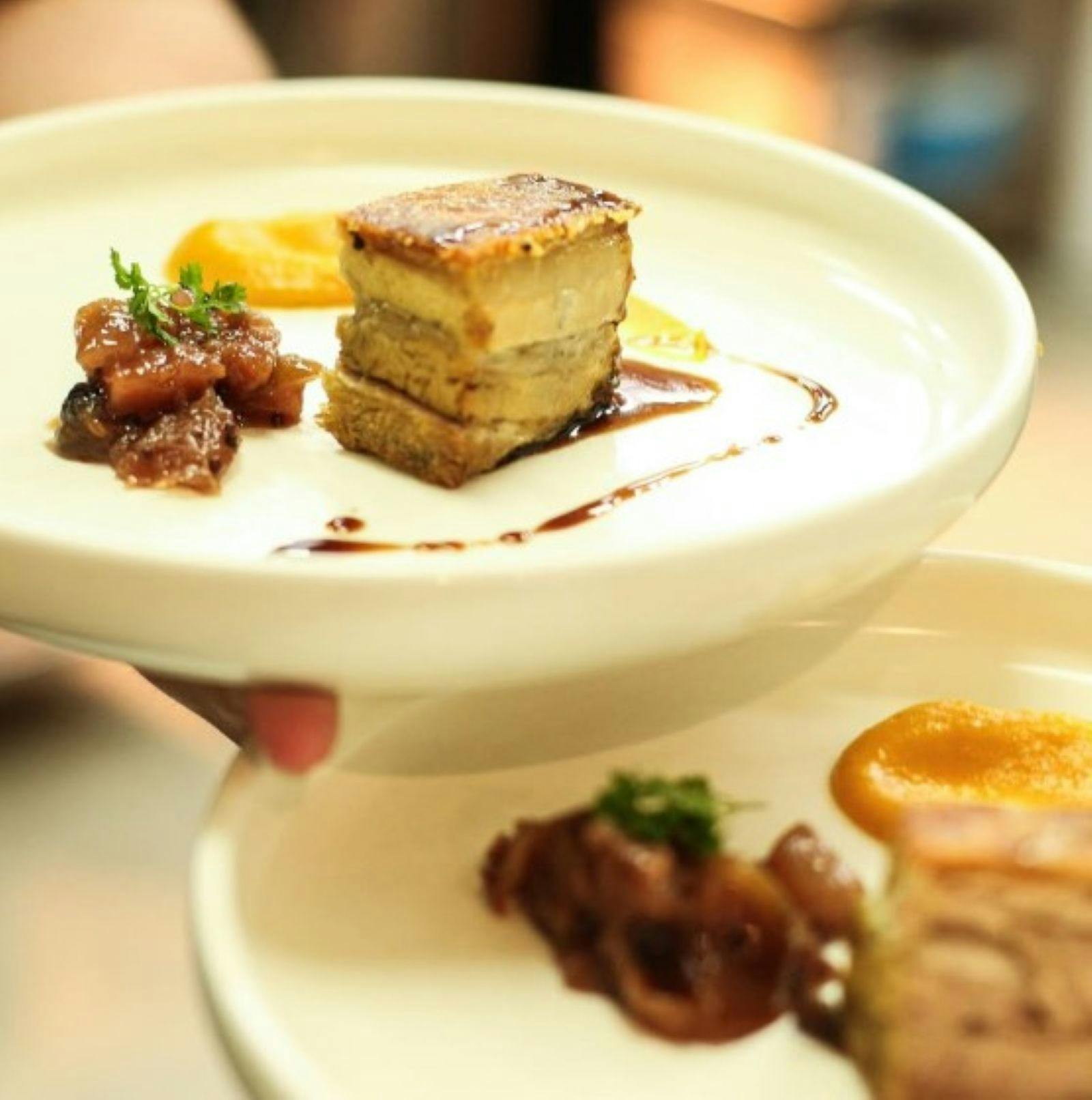 A plated dish pork belly