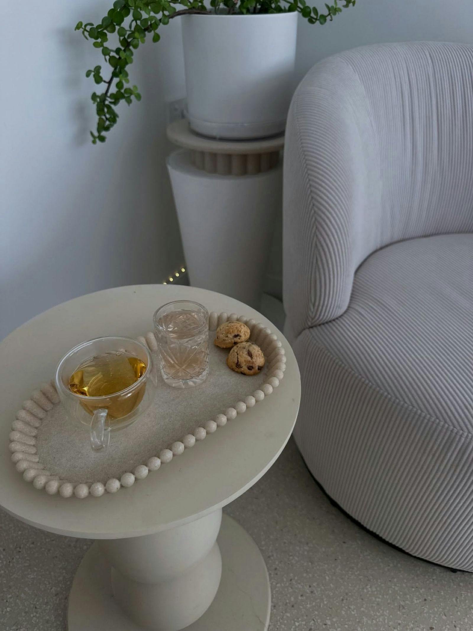 Tea and cookies on a table after a wellness treatment