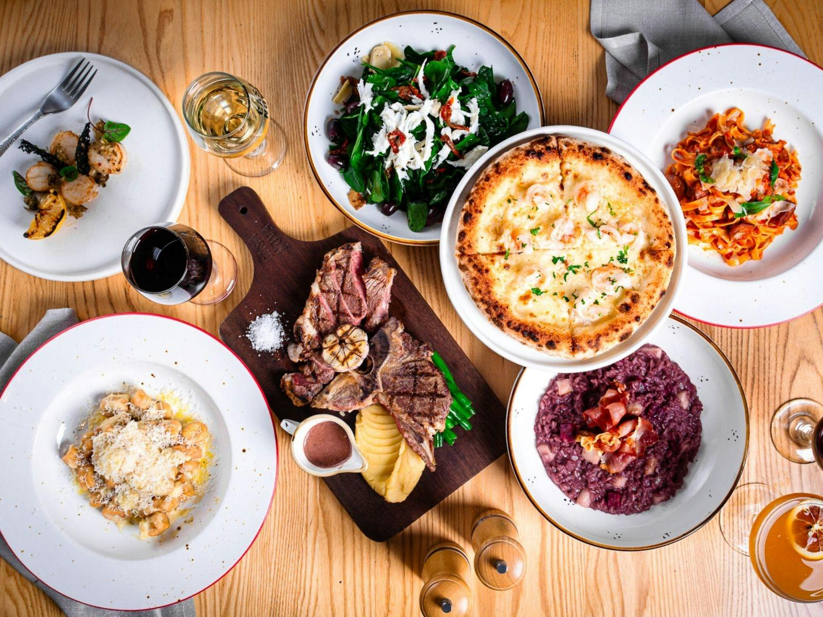 Various Italian dishes plated on table