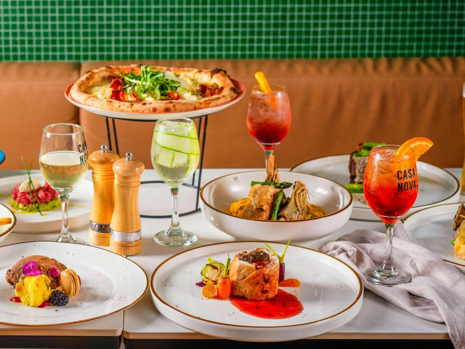Table set with dishes and cocktails