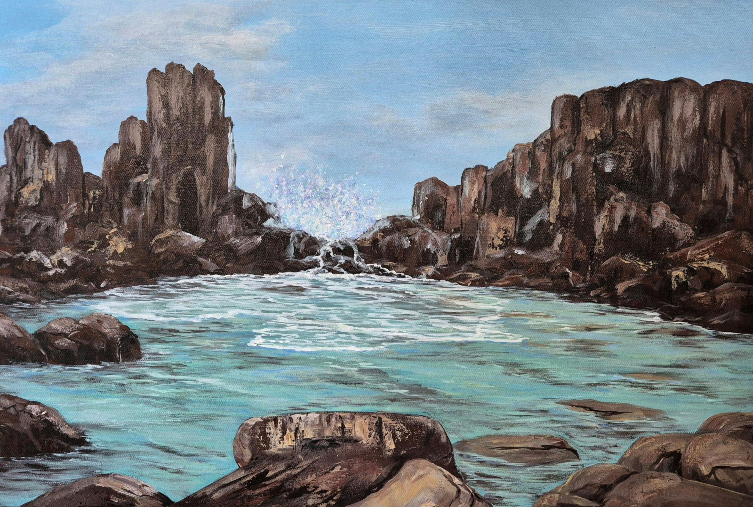 Painting of rocks and blue ocean