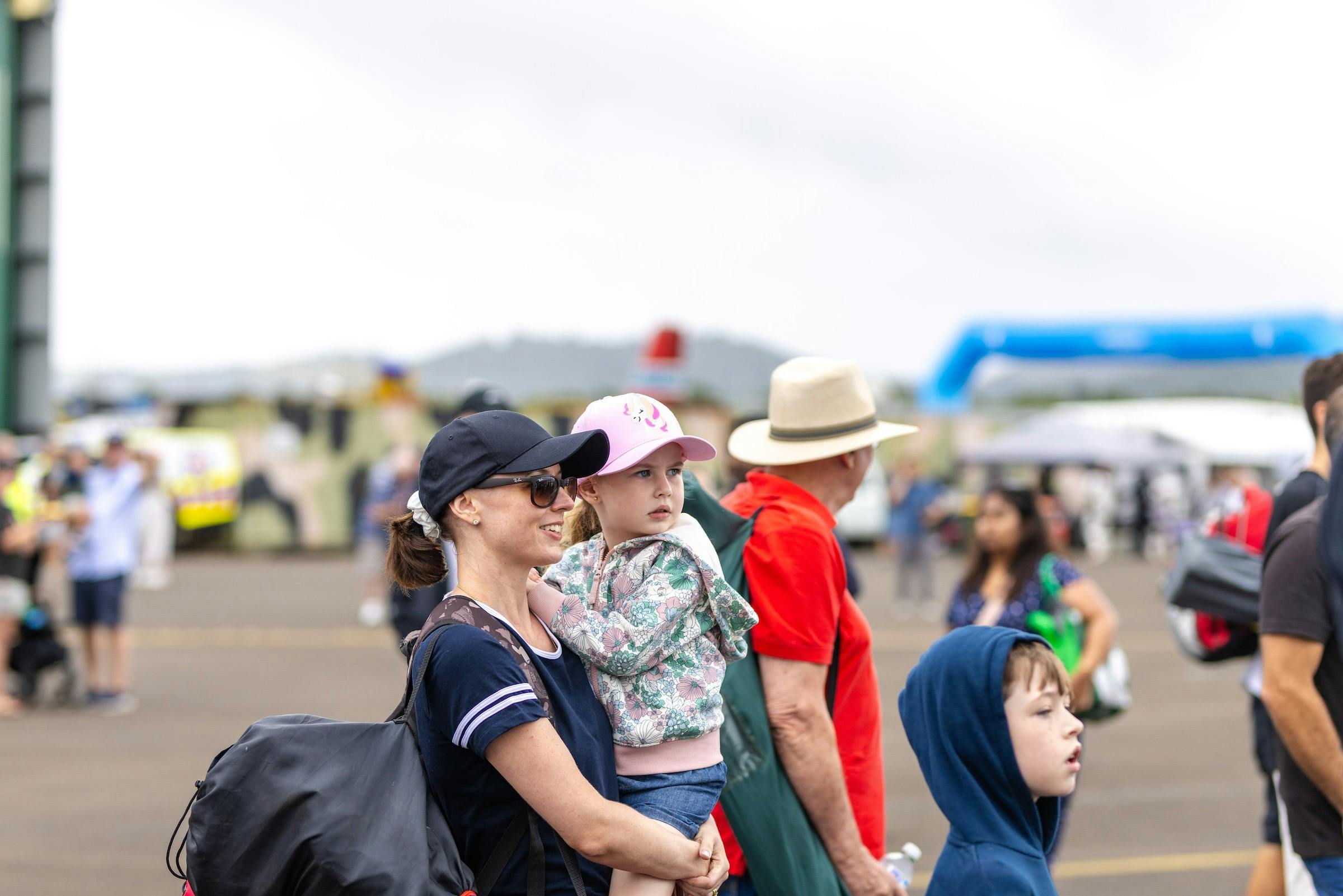 A family enjoying the thrilling flying displays at the airshow