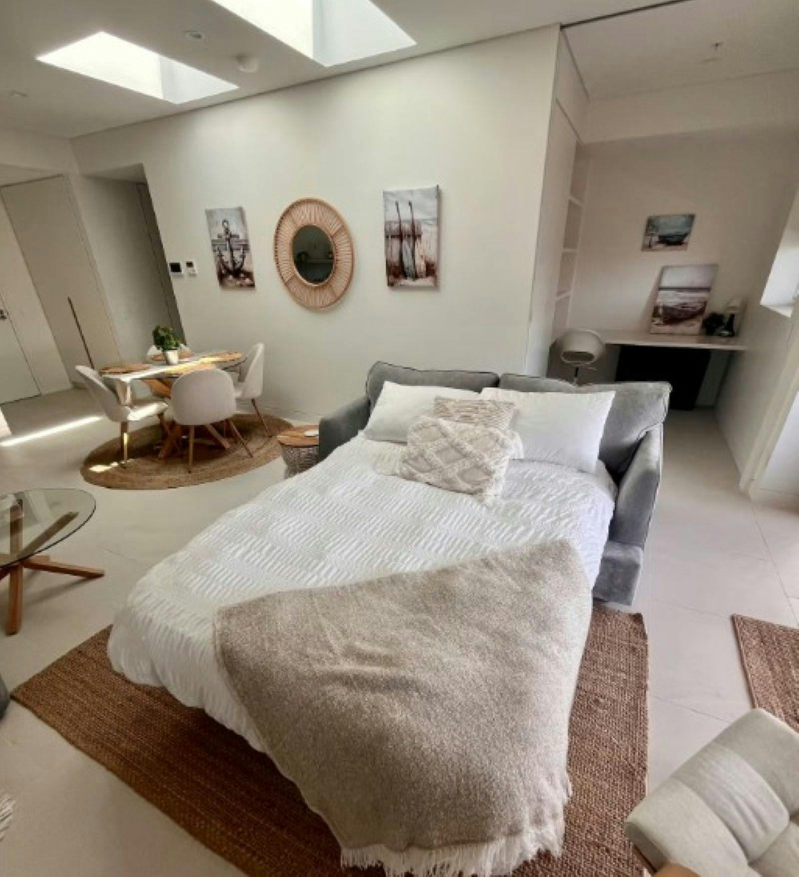 Interior view of unit with sofa bed made up