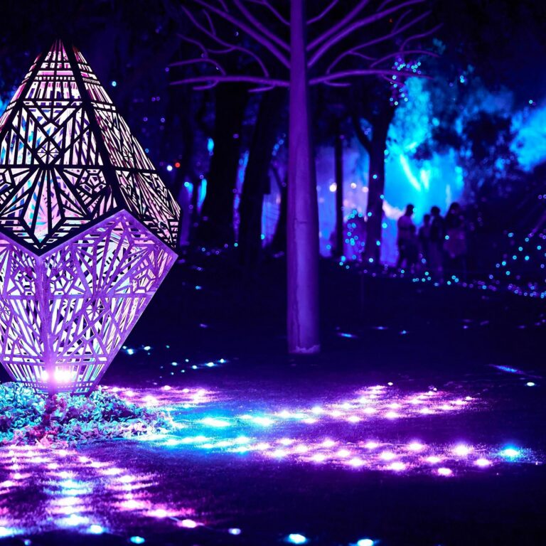 Nightime lights through a sculpture