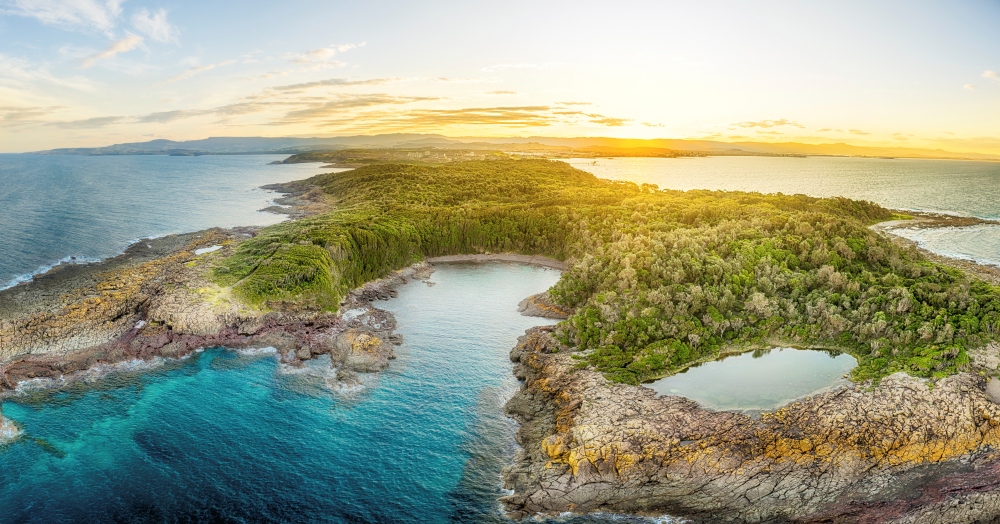 Aerial View of Bushrangers Bay, Bass Point Reserve at sunset