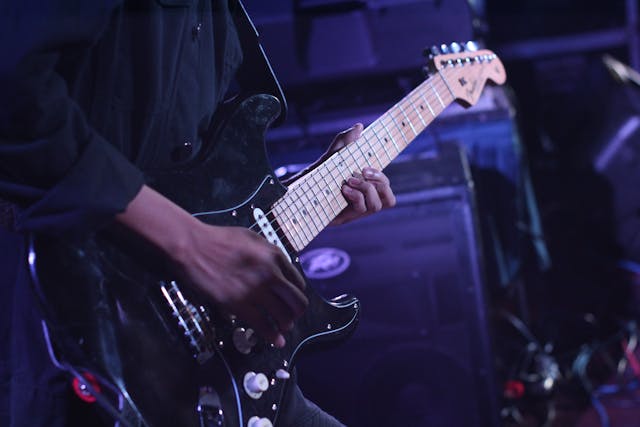 Person playing guitar
