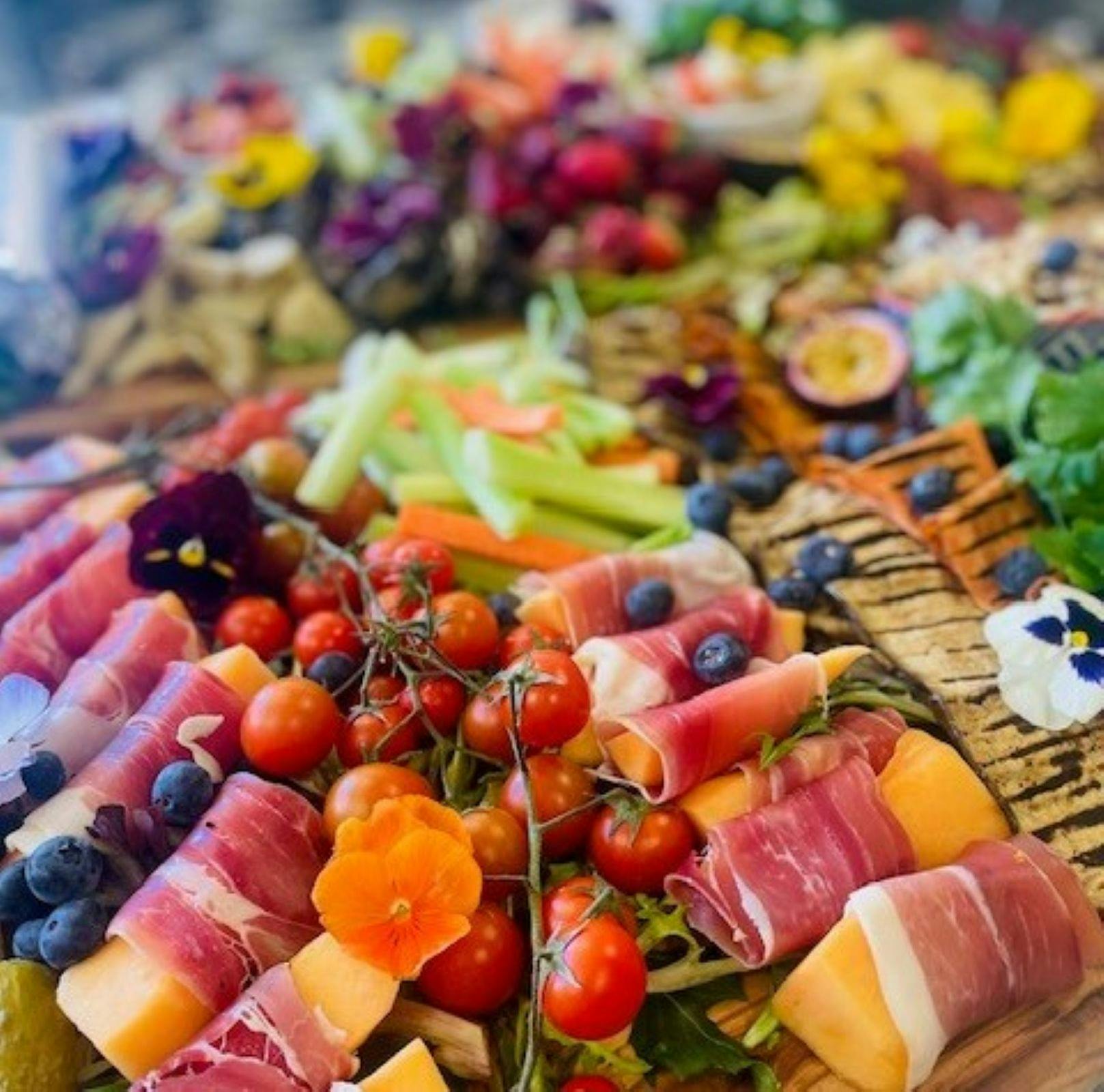 Antipasto plate with fruit and cold meats