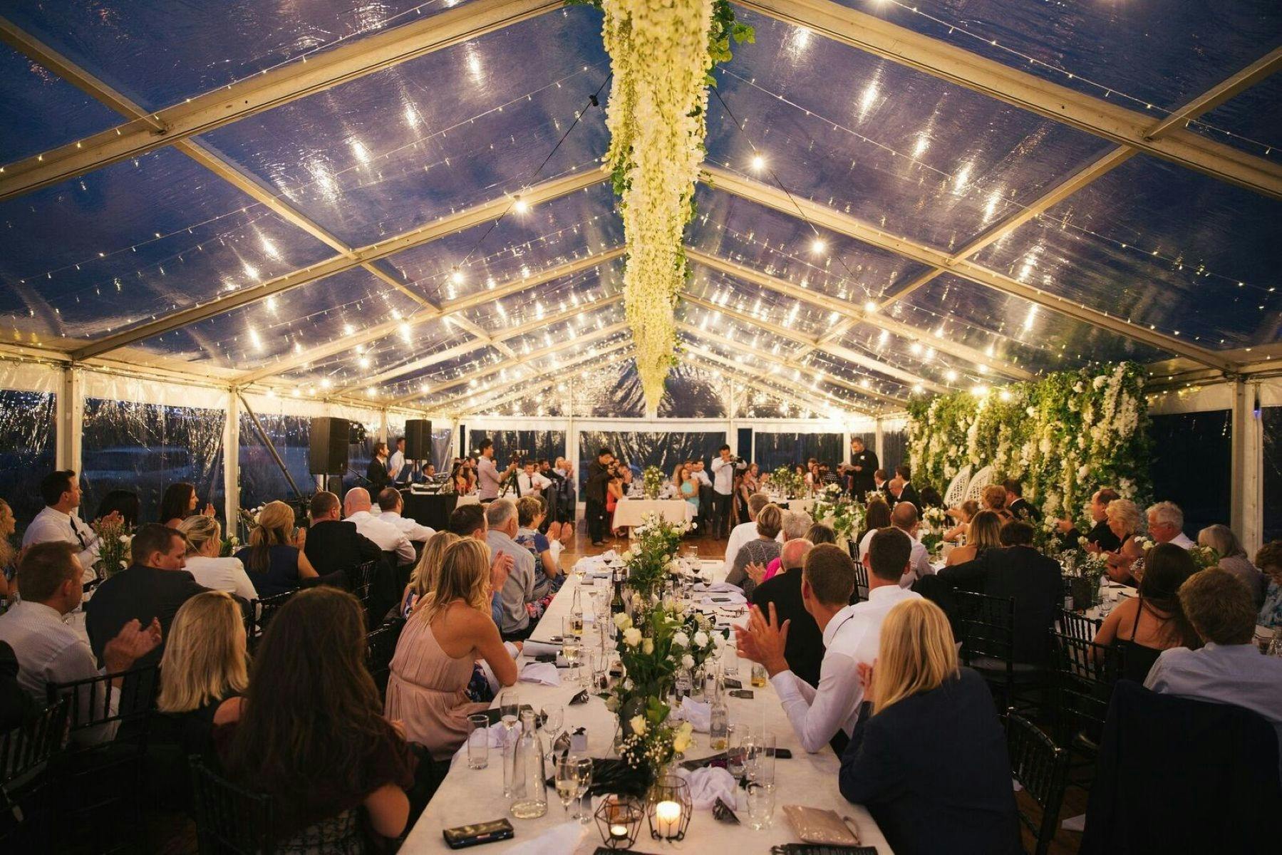 Venue Wedding with tables and guests under the lights