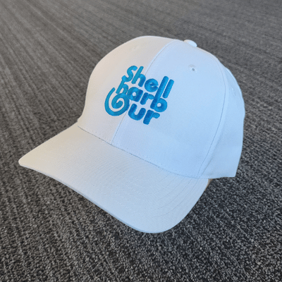 White cap with blue Shellharbour branding