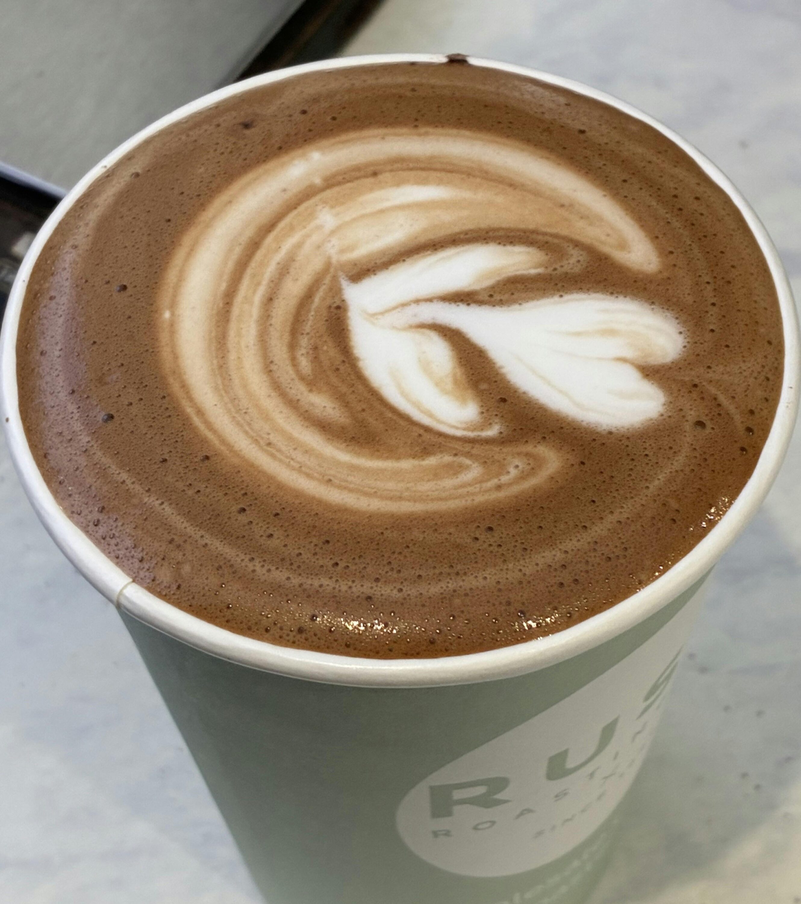 Coffee with a love heart decorated in the crema