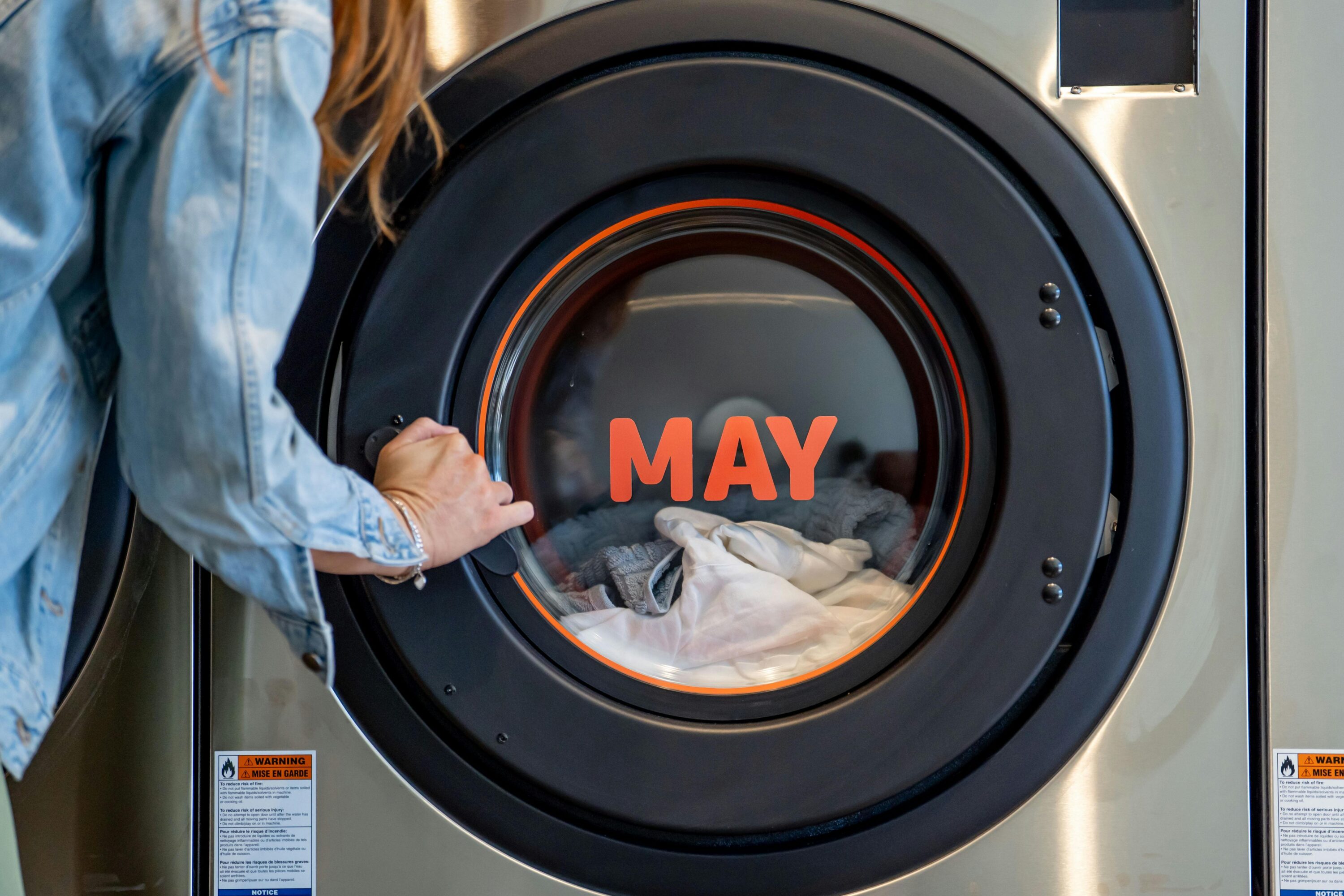 Washing maching with May written on the door
