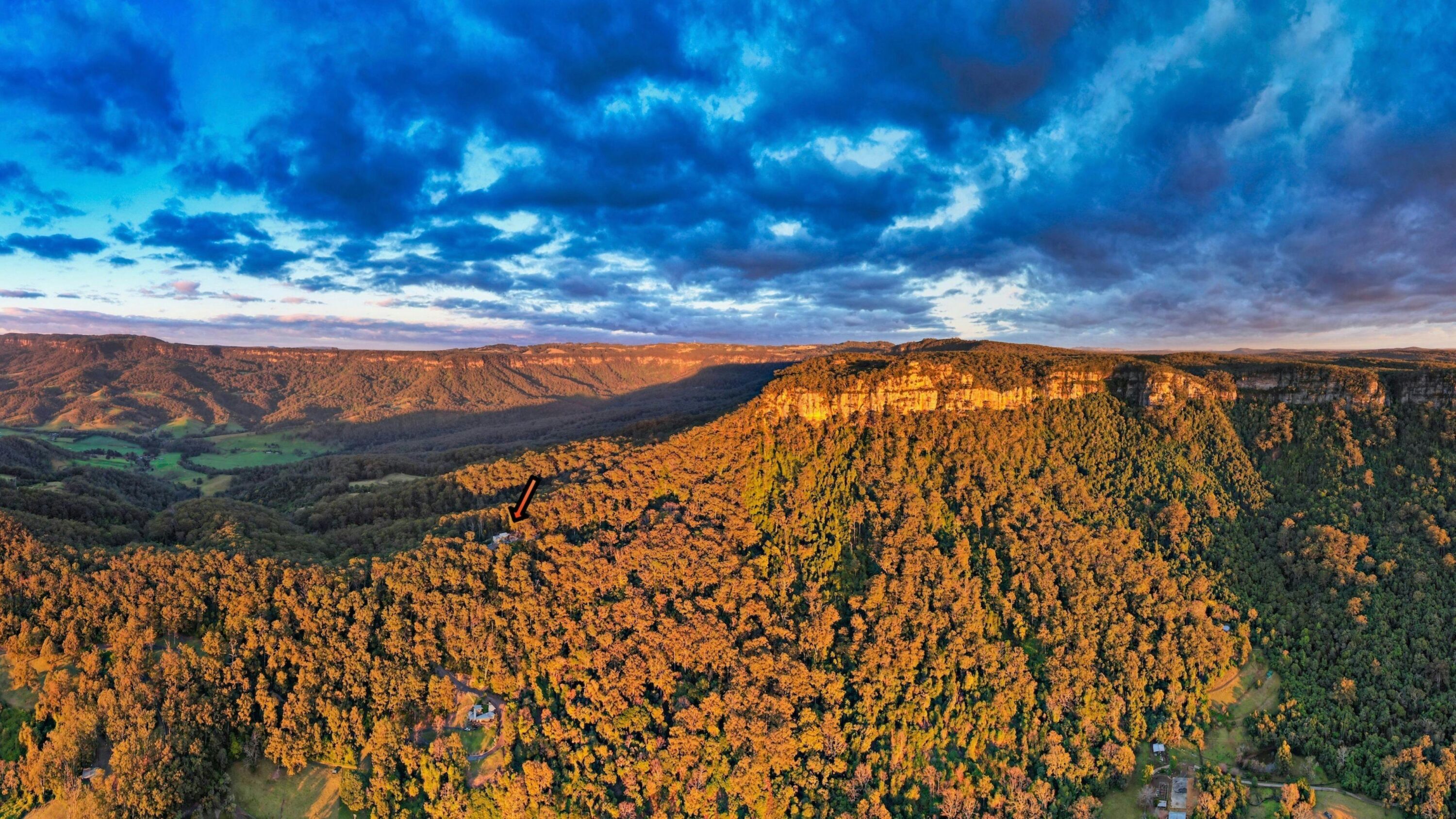 Look for the small orange arrow - it's pointing to the property which sits on a ridge line that leads right to the top of the escarpment.