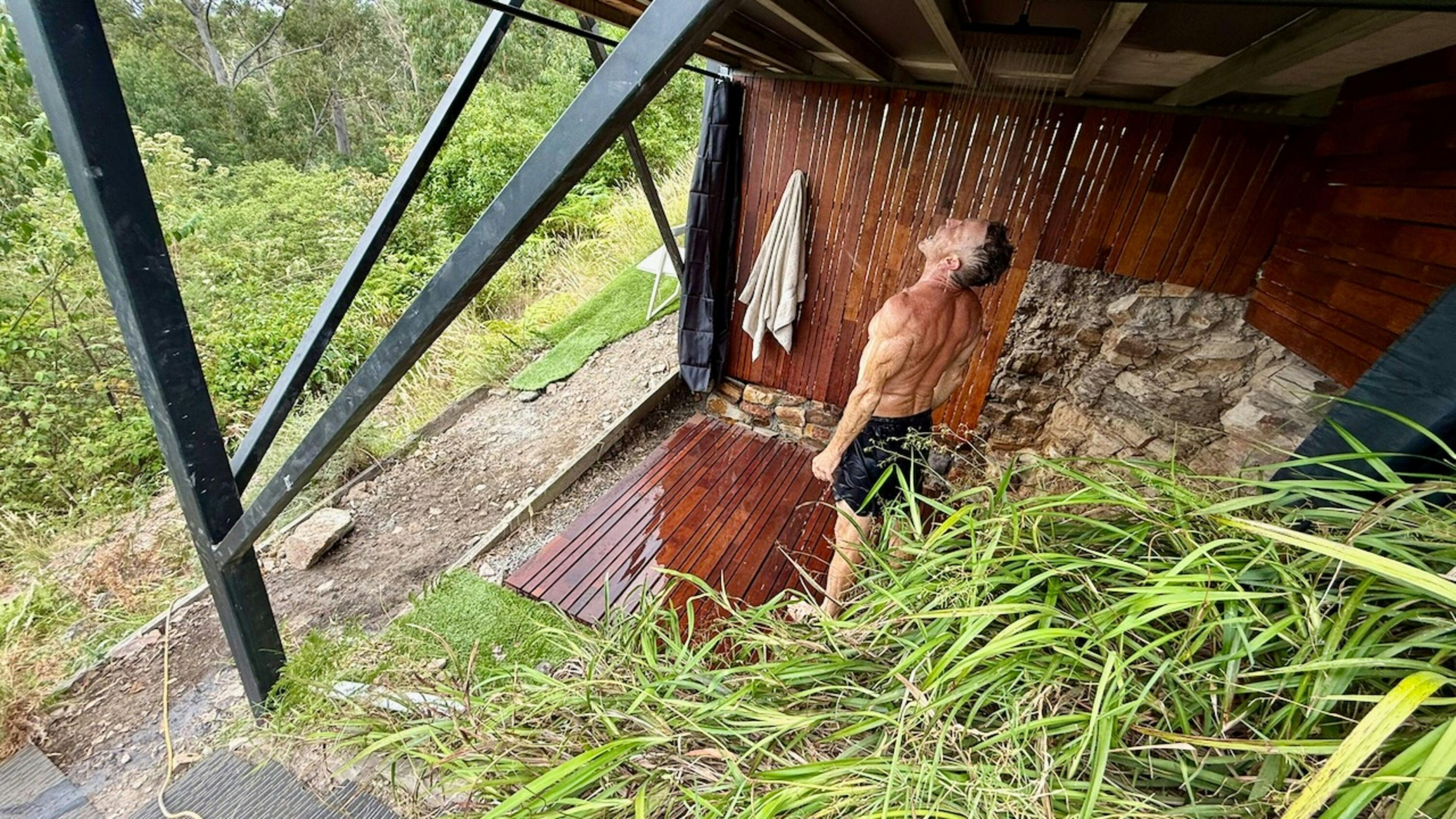 We just finished this shower under the house. It's $9 for 4 minutes because nothing about off grid is remotely cheap or easy - but the view is epic.