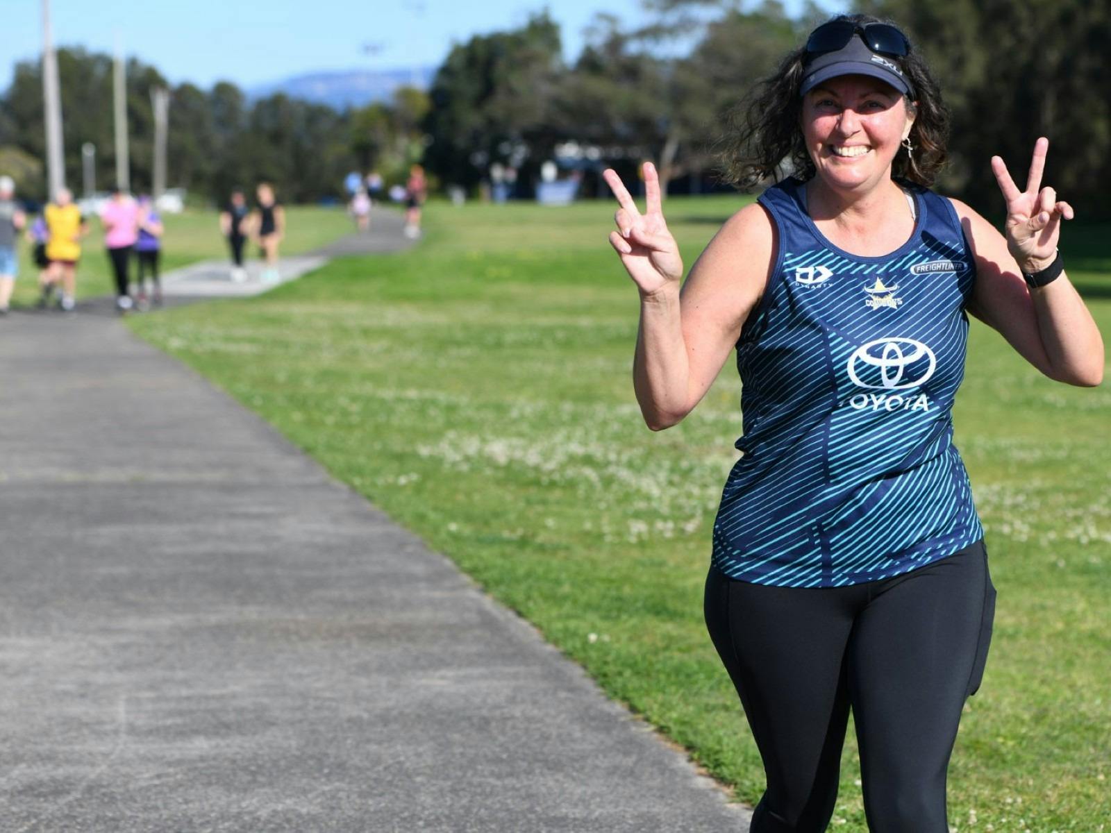 Person running on a pathway for Reddall Reserve parkrun